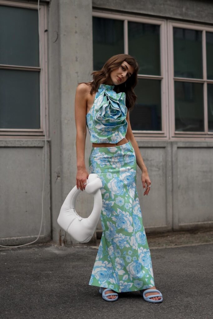 Blue and Green Floral Halter Crop Top with Rosette + Matching Maxi Skirt + White Sculptural Handbag + Light Blue Padded Sandals