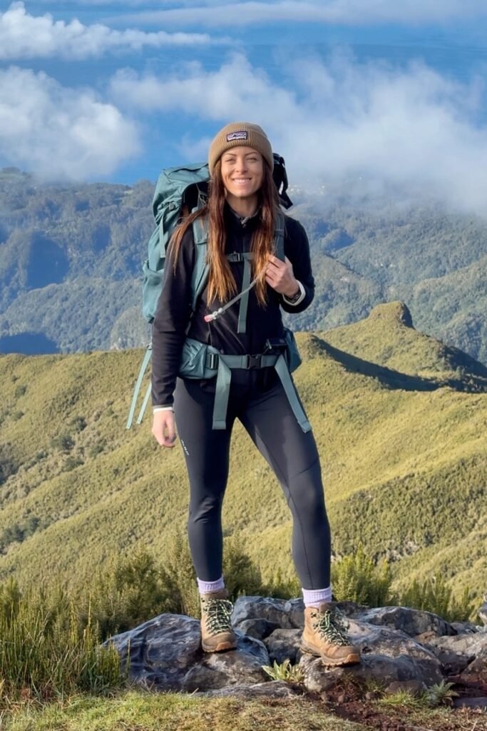 Brown Beanie + Black Zip-up Jacket + Black Leggings + Tan Hiking Boots