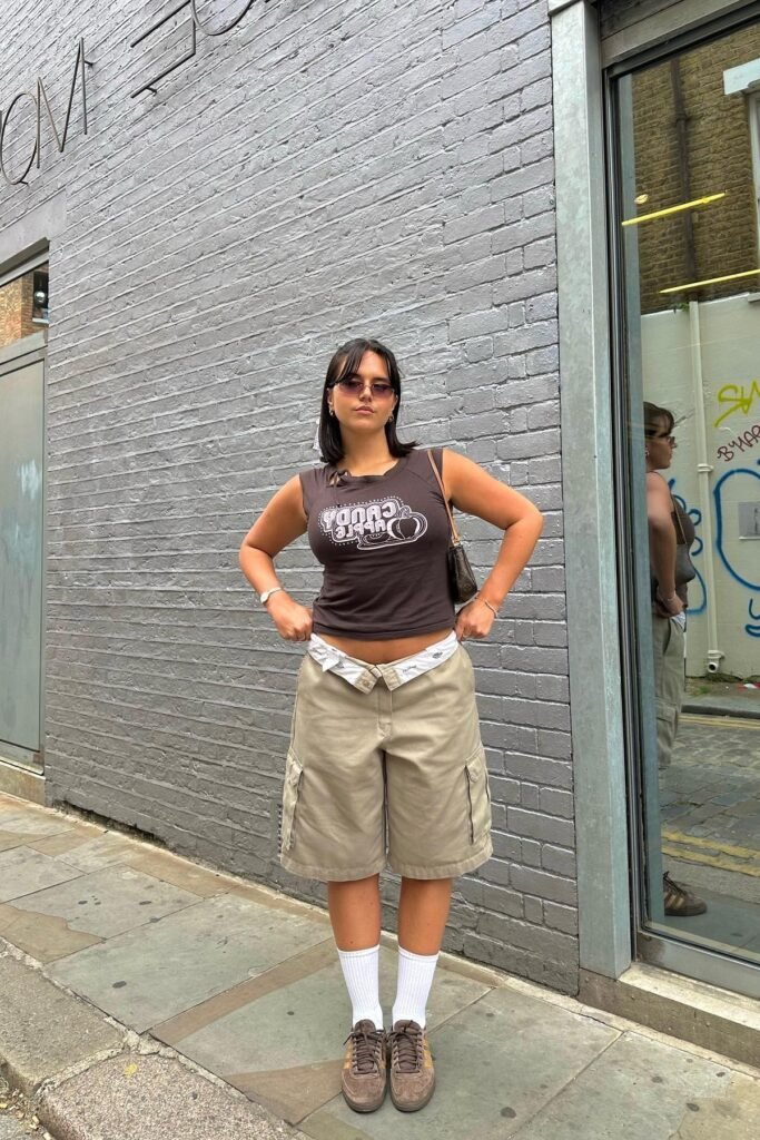 Brown Graphic Tank Top + Khaki Cargo Shorts + White Crew Socks + Brown Sneakers