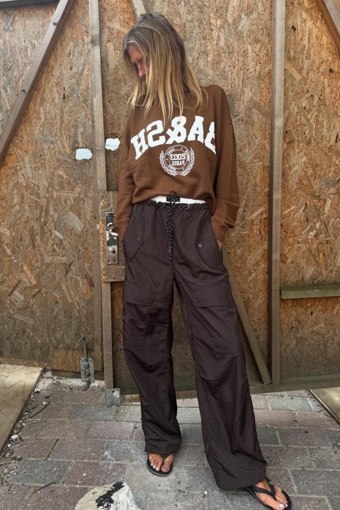 Brown Oversized Graphic Sweatshirt + Dark Brown Nylon Cargo Pants + Black Flip-Flops
