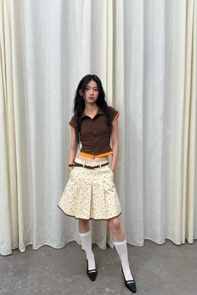 Brown and Orange Polo Crop Top + Floral Print Pleated Mini Skirt + White Knee-High Socks + Black Pointed-Toe Flats