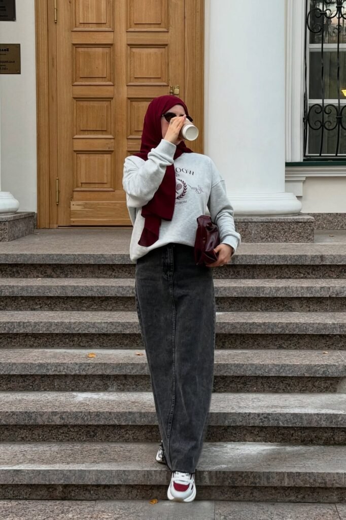Burgundy Hijab + Grey Graphic Sweatshirt + Charcoal Grey Denim Maxi Skirt + White and Burgundy Chunky Sneakers