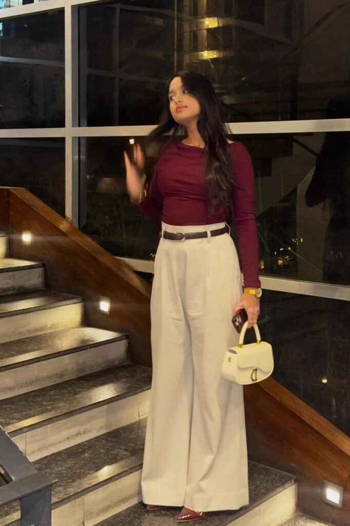 Burgundy Long-Sleeve Top + White Wide-Leg Trousers + Dark Brown Belt