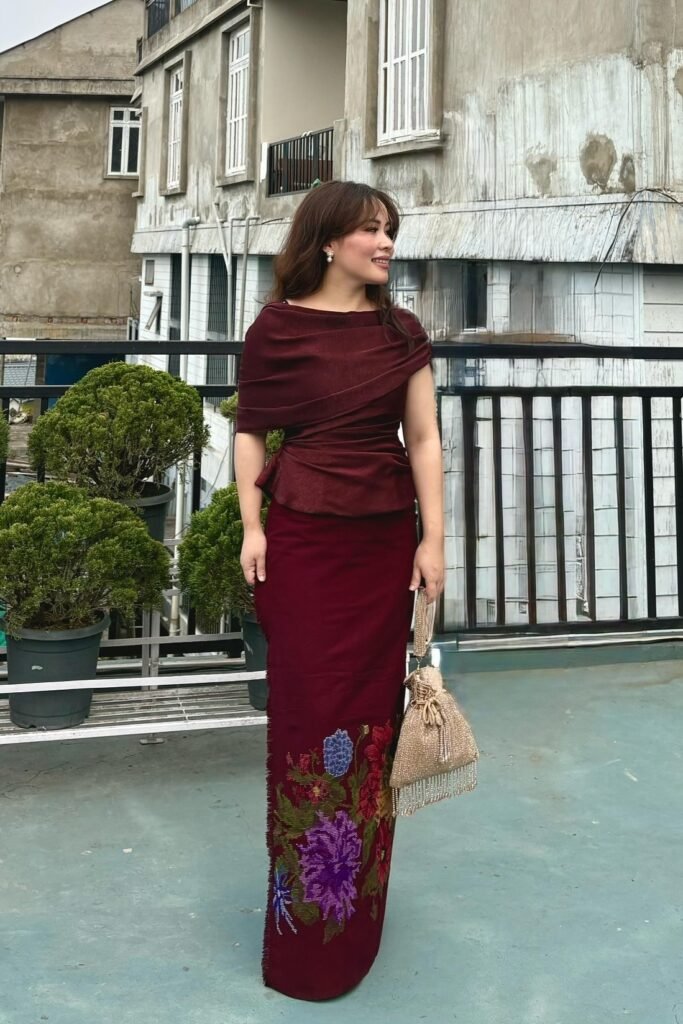 Burgundy Wrapped Peplum Top + Floral Embroidered Longyi + Gold Beaded Tassel Bag