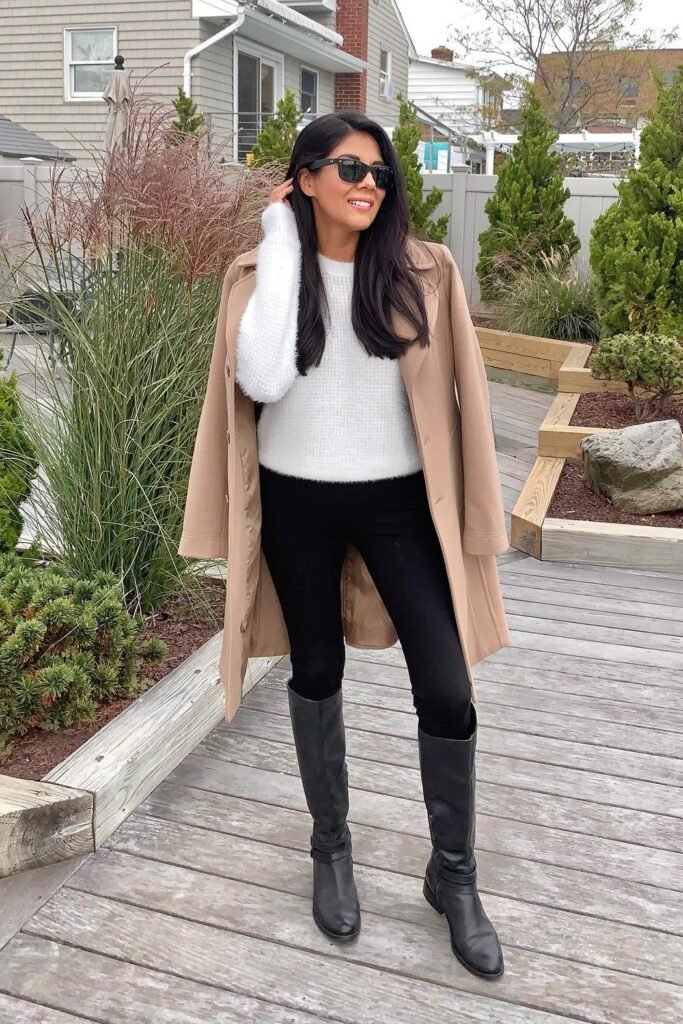 Camel Mid-Length Coat + White Textured Sweater + Black Leggings + Black Knee-High Leather Boots