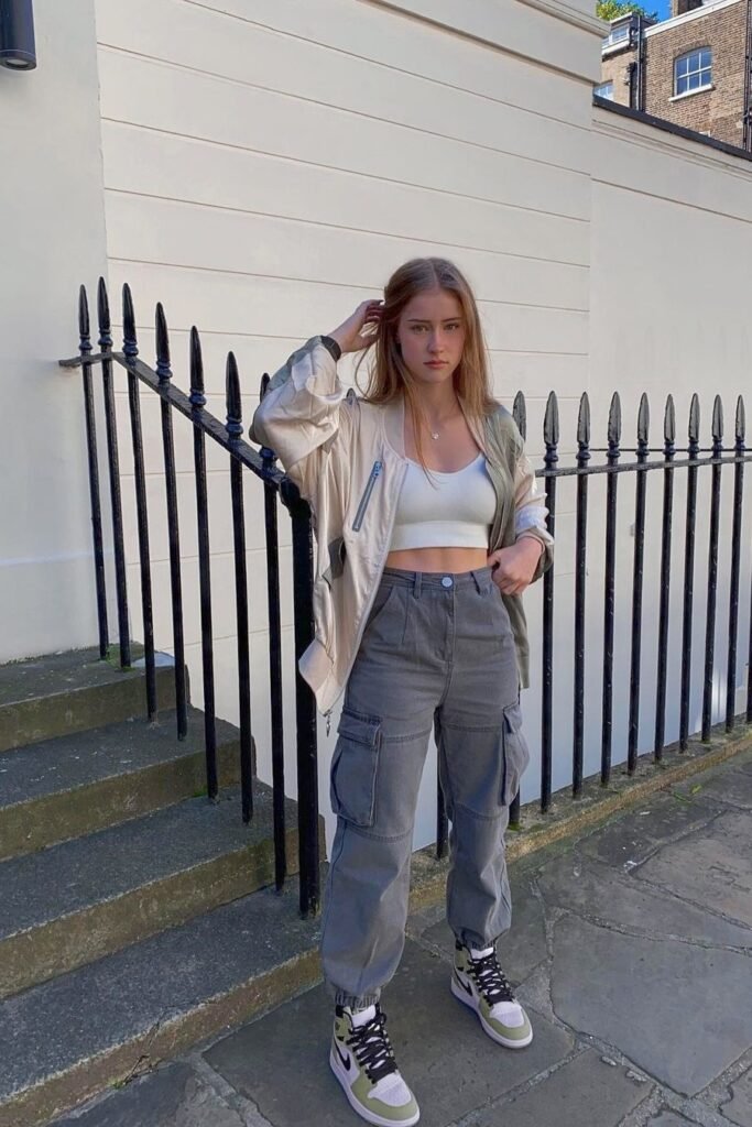  Cream Bomber Jacket + White Crop Top + Grey Cargo Joggers + High-Top Sneakers