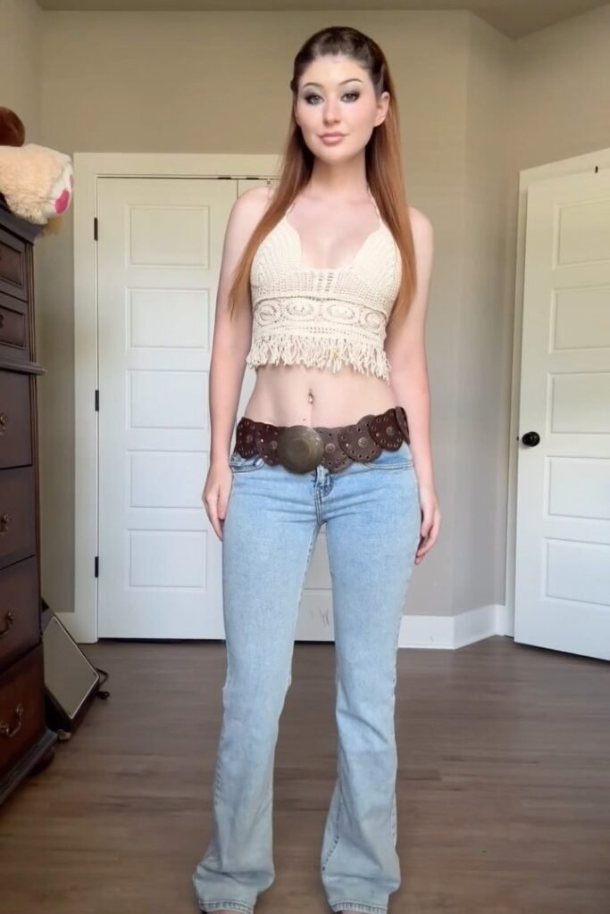 Cream Crochet Halter Top + Light Wash Low-Rise Flared Jeans + Brown Western Medallion Belt