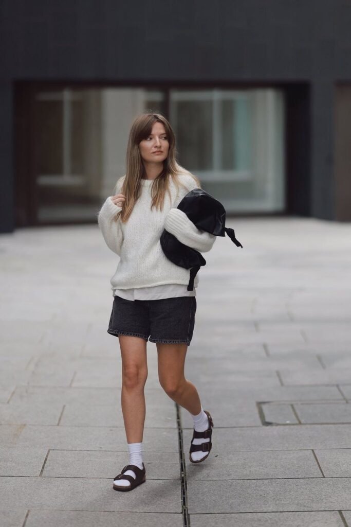 Cream Fuzzy Sweater + Black Denim Shorts + White Crew Socks + Dark Brown Double-Strap Sandals