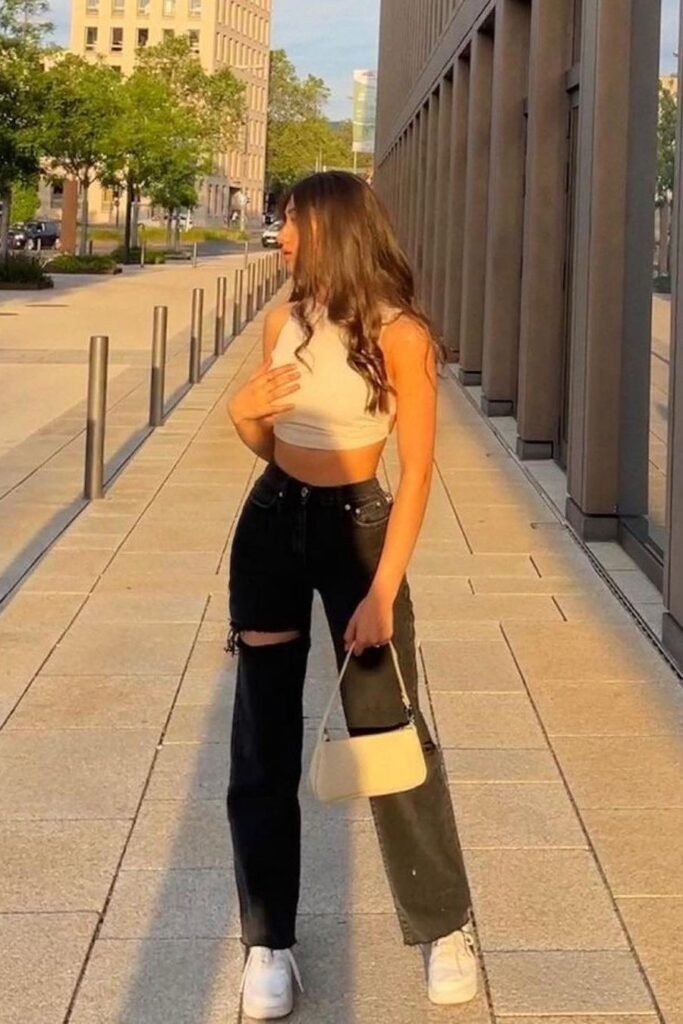 Cream Halter Crop Top + Black Distressed Wide-Leg Jeans + White Sneakers