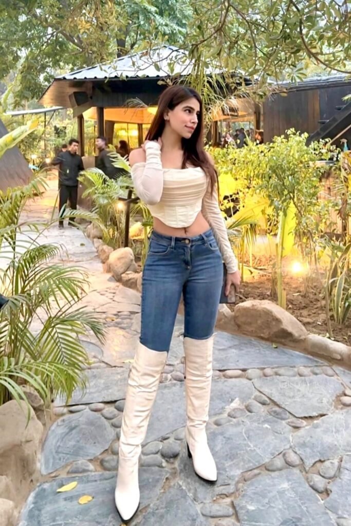 Cream Ruched Long-Sleeve Corset + Slim-Fit Blue Jeans + Cream Over-the-Knee Boots