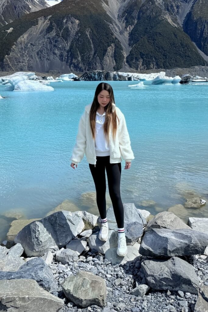 Cream Sherpa Fleece Jacket + Black High-Waisted Leggings + White Athletic Sneakers