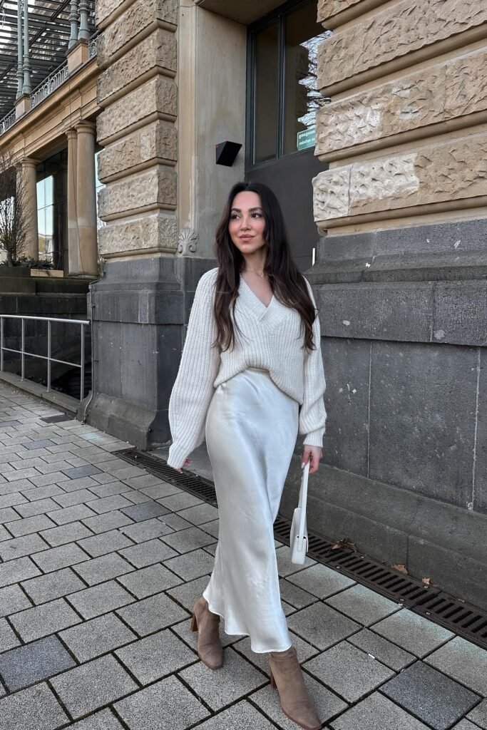 Cream V-Neck Ribbed Sweater + White Satin Midi Skirt + Tan Suede Ankle Boots