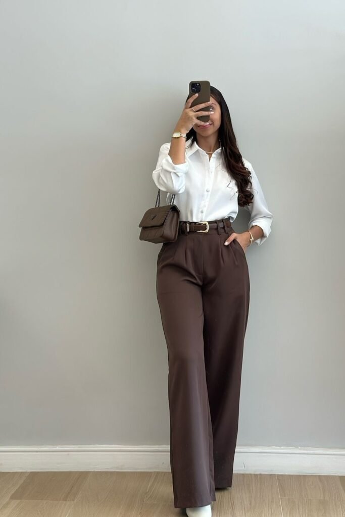 Crisp White Button-Down Shirt + Chocolate Brown High-Waisted Trousers + Brown Leather Belt + Quilted Brown Crossbody Bag