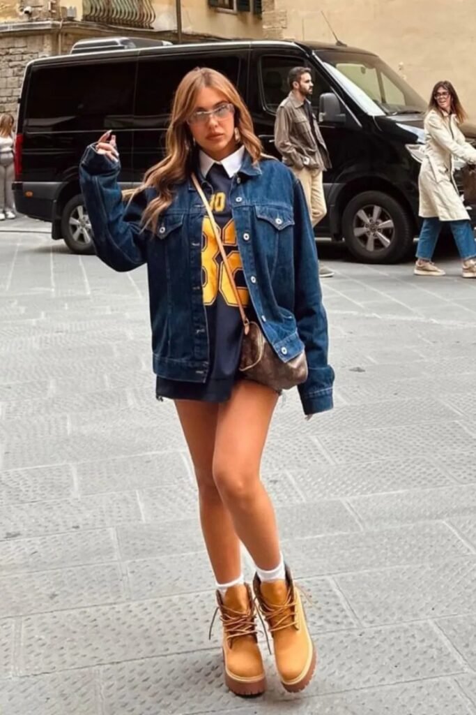 Denim Jacket + Navy Graphic Sweatshirt + White Collared Shirt + White Crew Socks + Tan Platform Boots