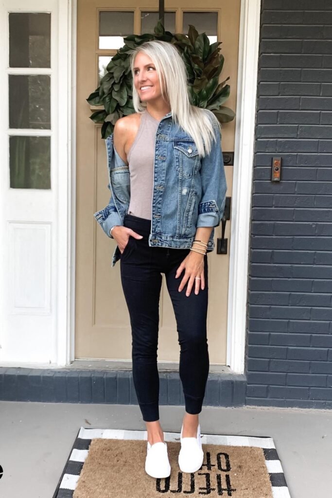 Distressed Denim Jacket + Black High-Rise Joggers + White Slip-on Sneakers