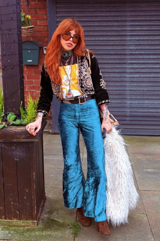 Embroidered Black Bolero Jacket + Graphic T-shirt + Teal Velvet Flared Trousers + Brown Suede Boots