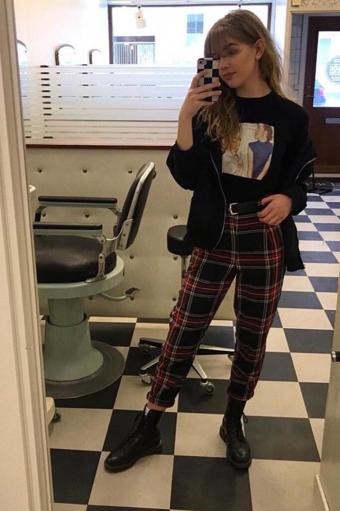 Graphic Black T-Shirt + Red and Black Plaid Trousers + Black Combat Boots