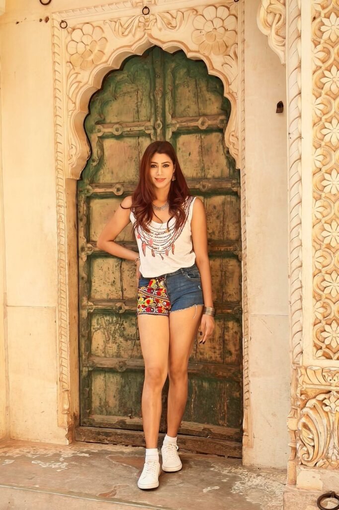 Graphic Tank Top + Patchwork Denim Shorts + White Sneakers