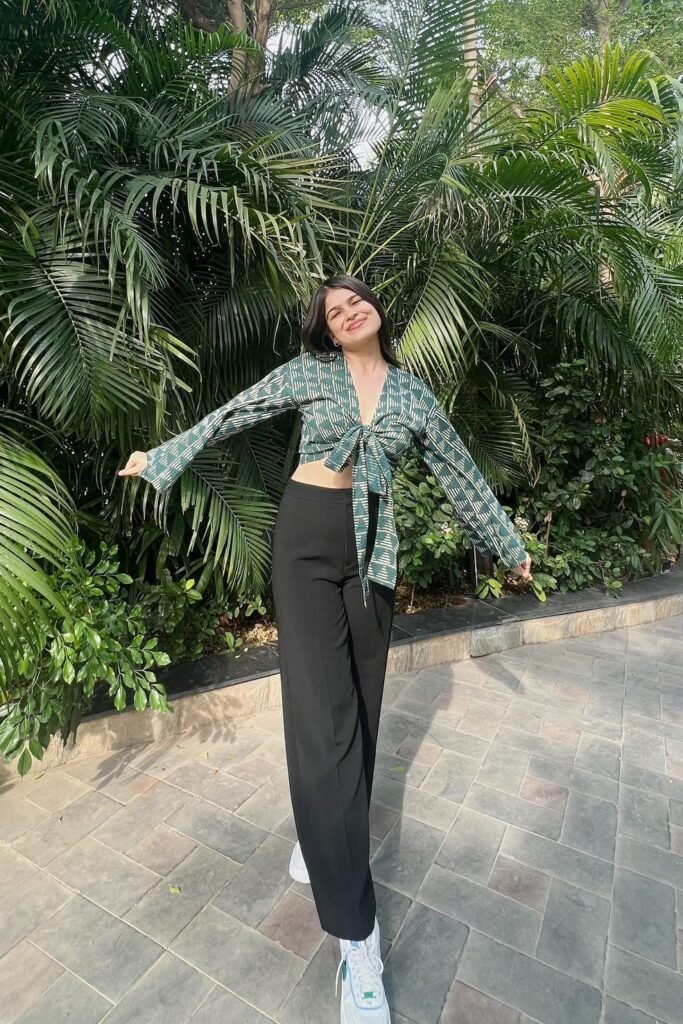 Green Patterned Tie-Front Crop Top + Black Straight-Leg Trousers + White Sneakers