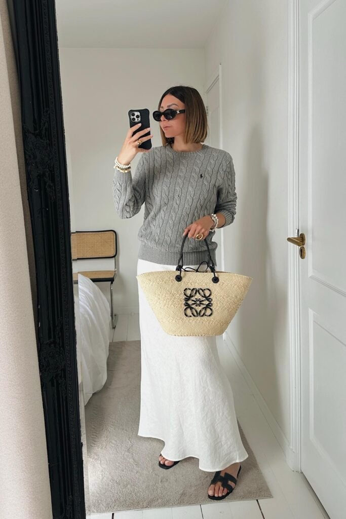 Grey Cable-Knit Sweater + White Satin Maxi Skirt + Black Slide Sandals