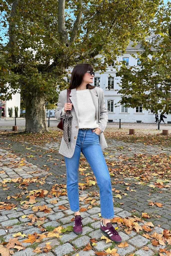 Grey Herringbone Blazer + White Crewneck Sweater + Blue Straight-Leg Jeans + Burgundy Suede Sneakers