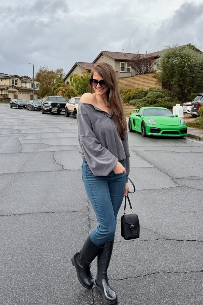 Grey Off-the-Shoulder Sweatshirt + Medium Wash Skinny Jeans + Black Tall Rain Boots