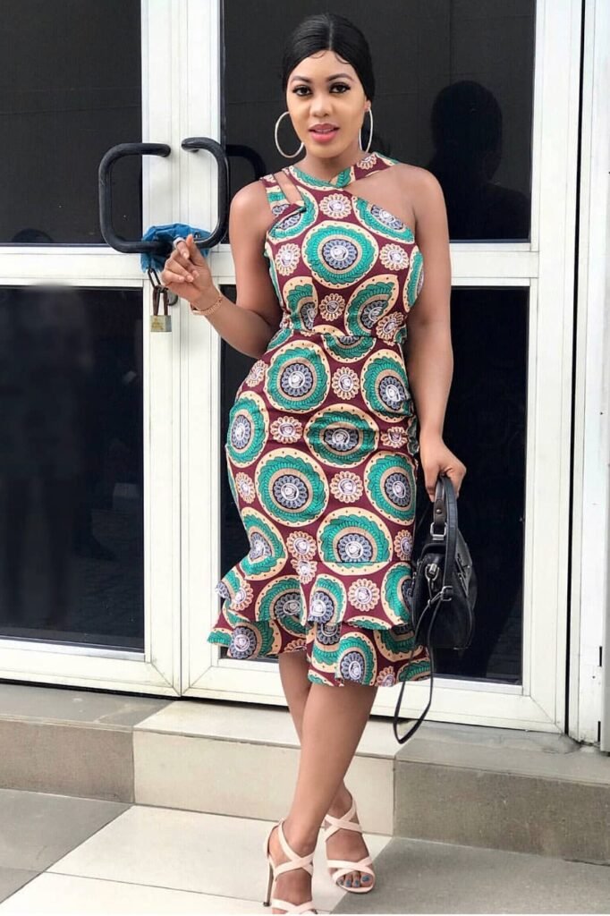  Halter-Neck Ankara Mermaid Dress + Black Handbag + Beige Strappy Heels