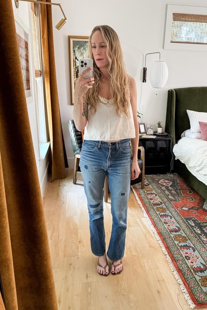 Lace-Trimmed White Cami + Distressed Straight-Leg Jeans + Brown Flip Flops