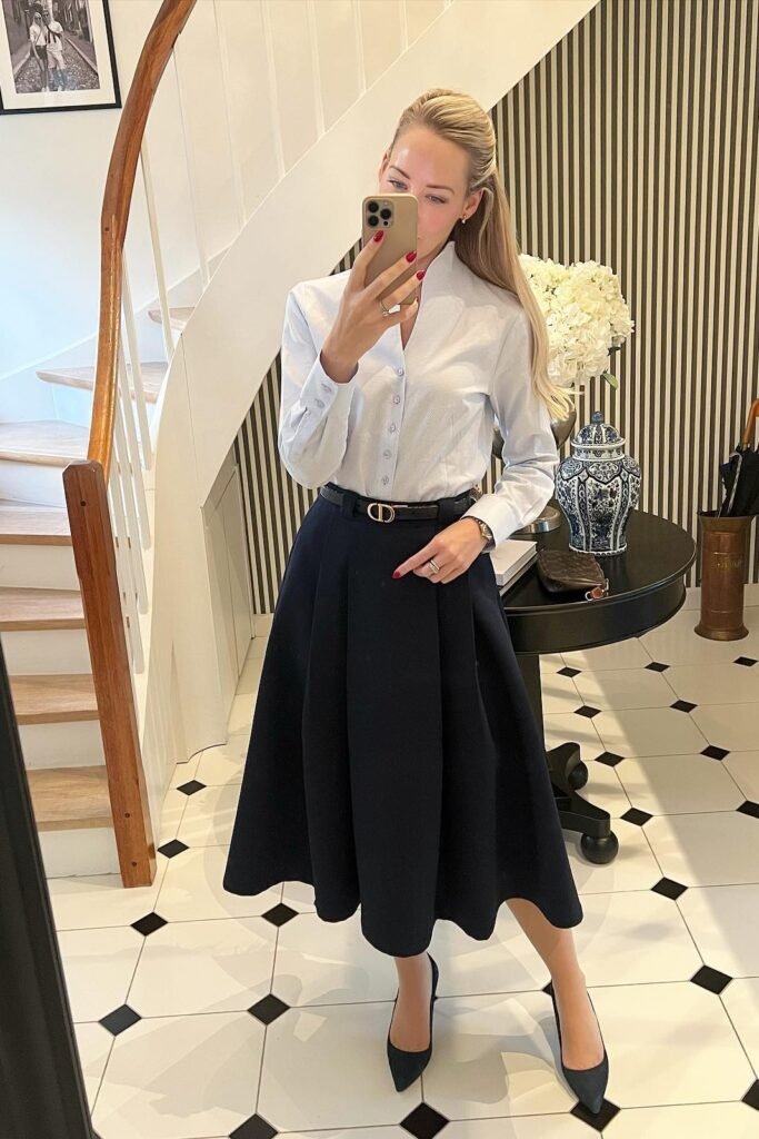Light Blue Button-Down Shirt + Navy Pleated Midi Skirt + Black Pointed-Toe Heels