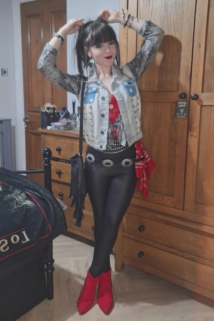 Light Wash Studded Denim Vest + Red Lace Top + Black Shiny Leggings + Red Pointed-Toe Ankle Boots