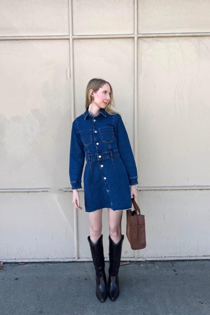 Long Sleeve Denim Mini Dress + Black Western-Style Boots + Brown Tote Bag