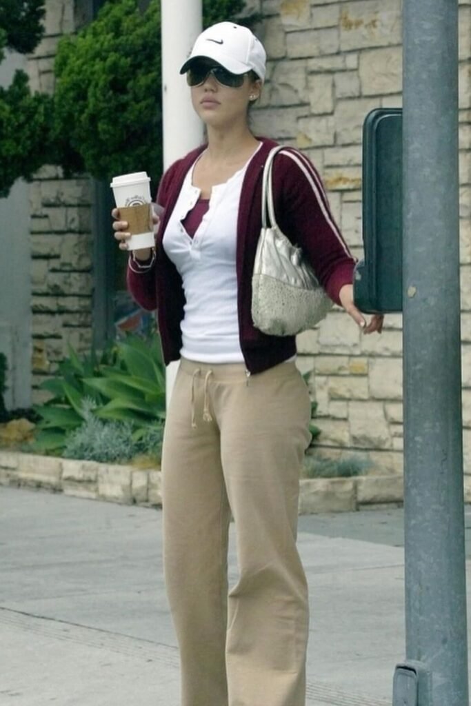 Maroon Cardigan over White Henley Top + Tan Wide-Leg Sweatpants + White Baseball Cap