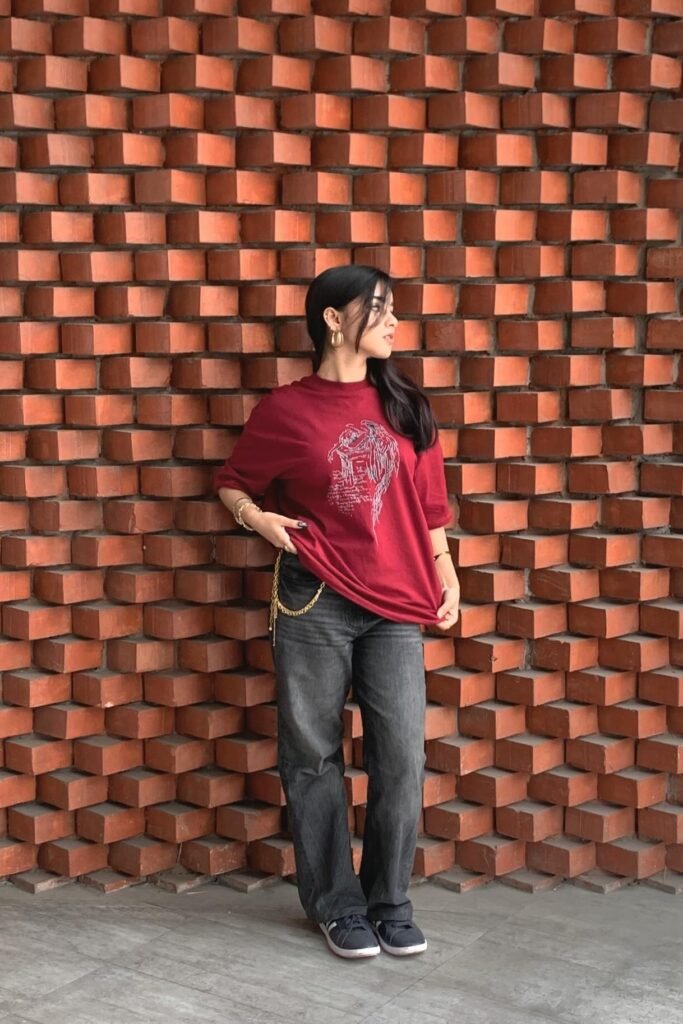 Maroon Graphic T-shirt + Dark Grey Baggy Jeans + Navy Blue Sneakers
