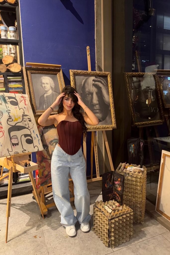 Maroon Pointed Corset + Sparkly Light-Wash Jeans + White Sneakers