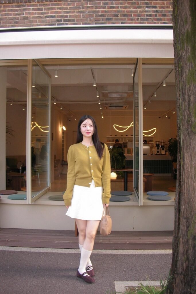 Mustard Yellow Cardigan + White Mini Skirt + White Knee-High Socks + Burgundy Ballet Flats