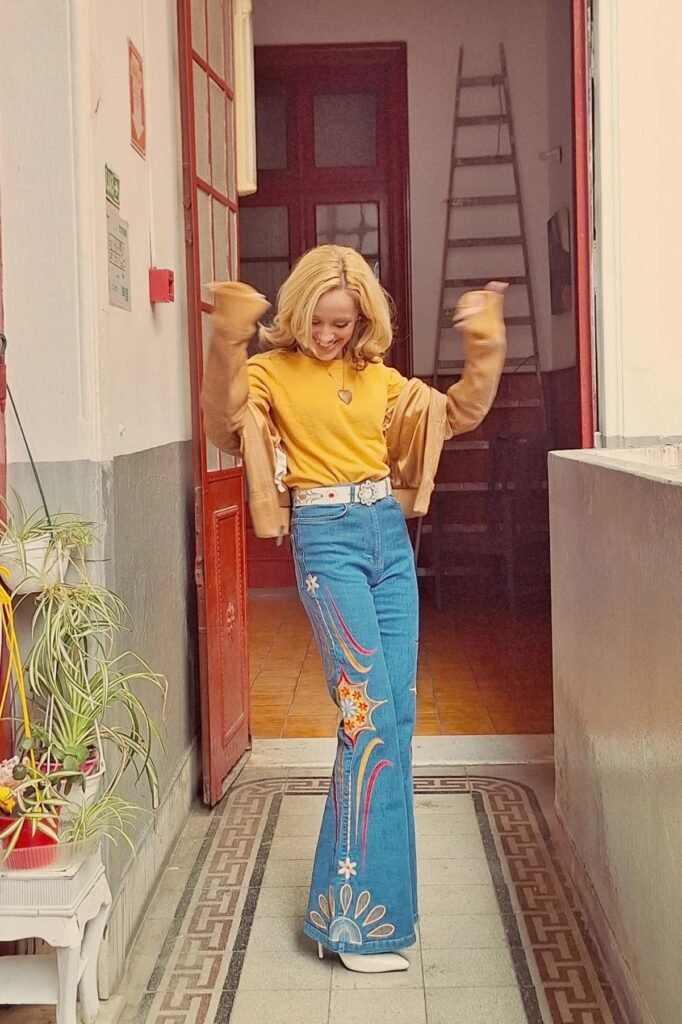 Mustard Yellow Crewneck Sweater + Embroidered Blue Bell-Bottom Jeans + White Pointed-Toe Heels