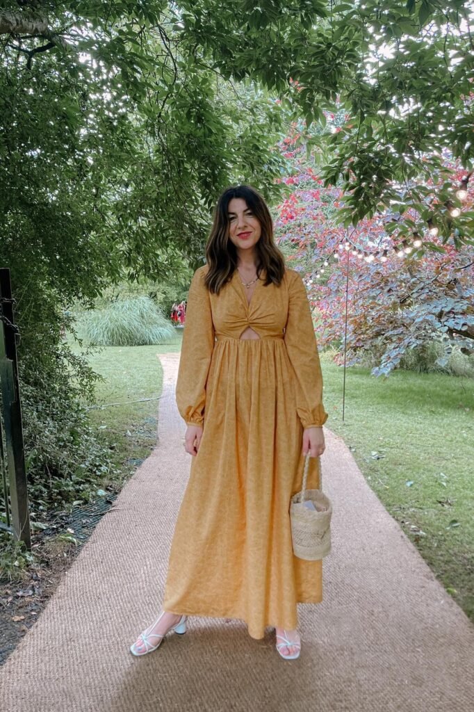 Mustard Yellow Cut-Out Maxi Dress + White Strappy Heeled Sandals + Straw Bucket Bag