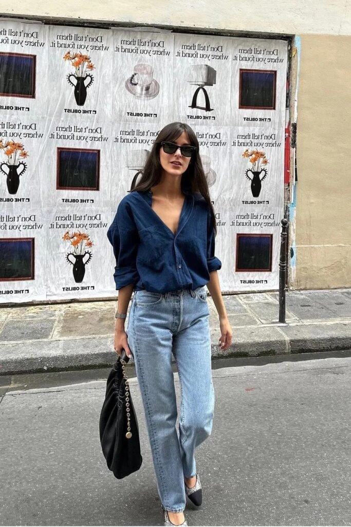 Navy Blue Button-Down Shirt + Medium Wash Straight-Leg Jeans + Black and White Cap-Toe Flats