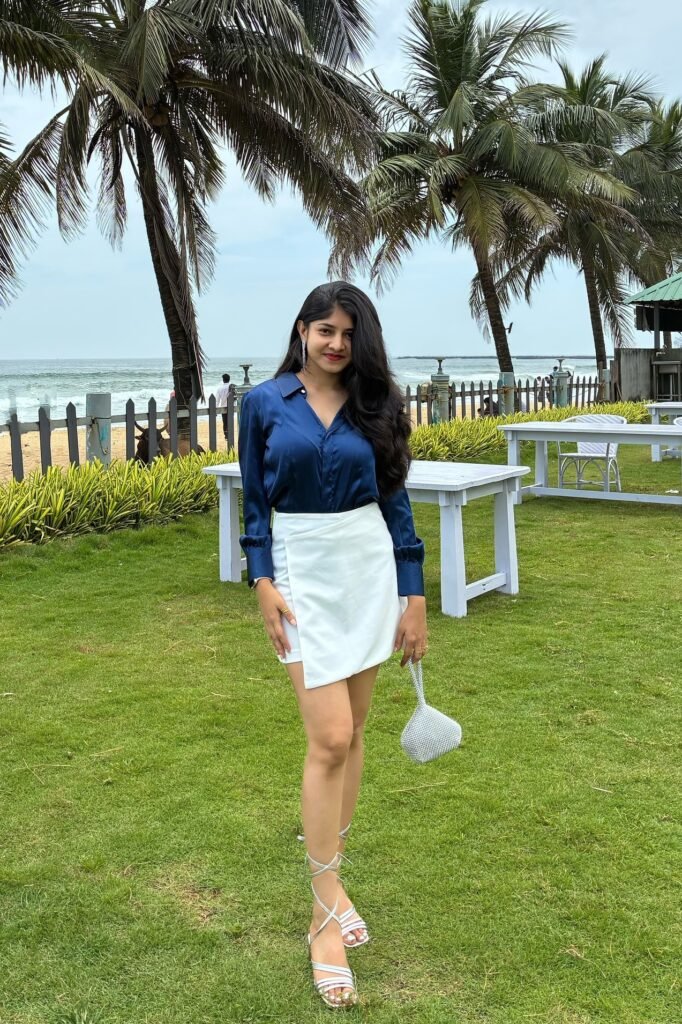 Navy Blue Satin Button-Down Shirt + White Asymmetrical Mini Skirt + Silver Lace-up Heels