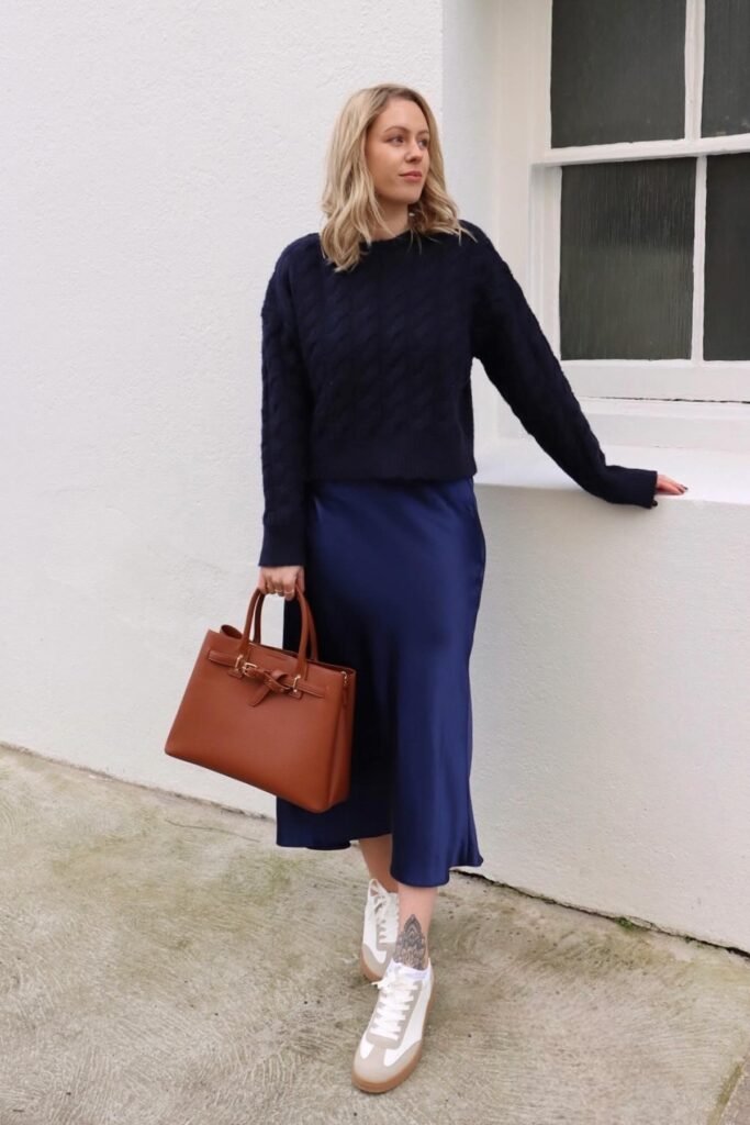 Navy Cable-Knit Sweater + Blue Satin Midi Skirt + White & Tan Sneakers