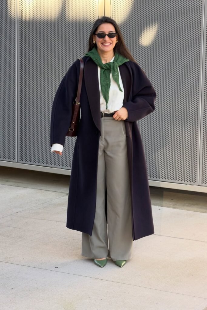 Navy Long Coat + White Blouse + Green Neck Scarf + Grey Wide-Leg Trousers + Green Pointed-Toe Heels