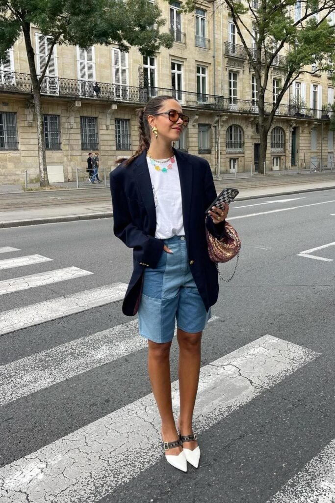 Navy Oversized Blazer + White T-Shirt + Patchwork Denim Shorts + Colorful Beaded Necklace + White Pointed-Toe Mules