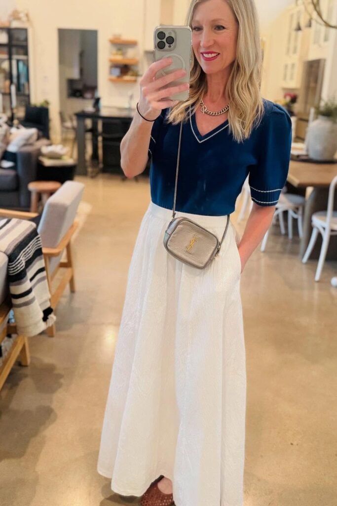 Navy Puff-Sleeve Knit Top + White Textured Maxi Skirt + Silver Metallic Crossbody Bag