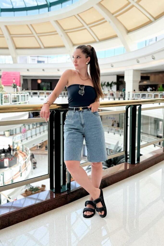 Navy Strapless Tube Top + Light Wash Denim Shorts + Thin Black Logo Belt + Black Double-Strap Sandals