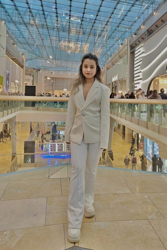 Off-White Cinched Blazer + White Flared Trousers + White Platform Sneakers