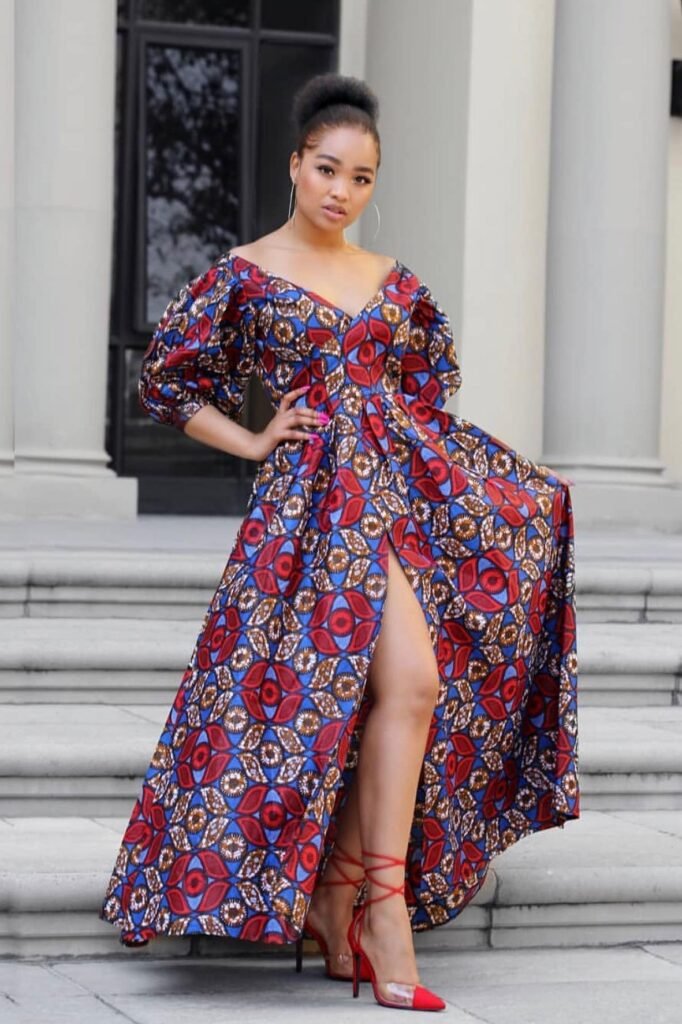 Off-the-Shoulder Ankara Gown with Thigh Slit + Red Lace-up Heels + Silver Hoop Earrings