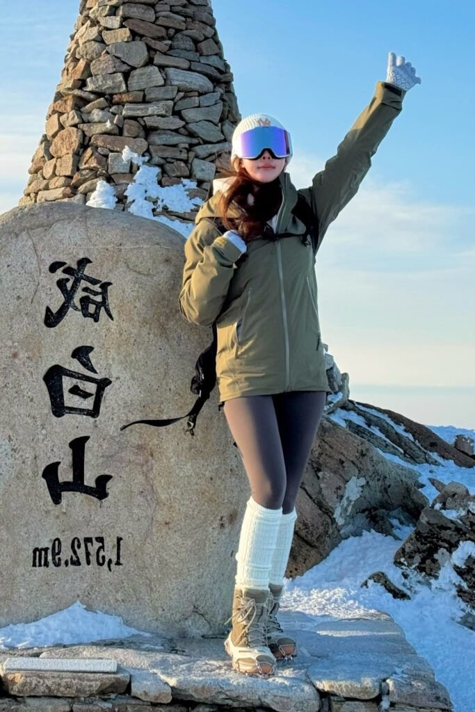 Olive Green Hardshell Parka + Charcoal Grey Leggings + Tan Snow Boots