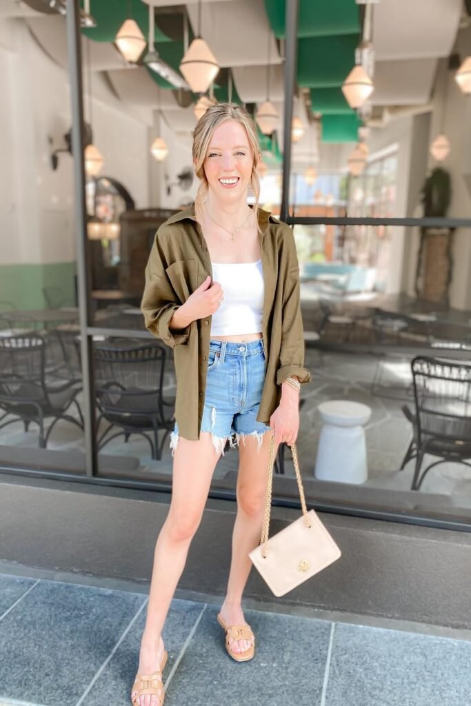 Olive Green Oversized Shirt + White Crop Top + Distressed Denim Shorts + Tan Slide Sandals