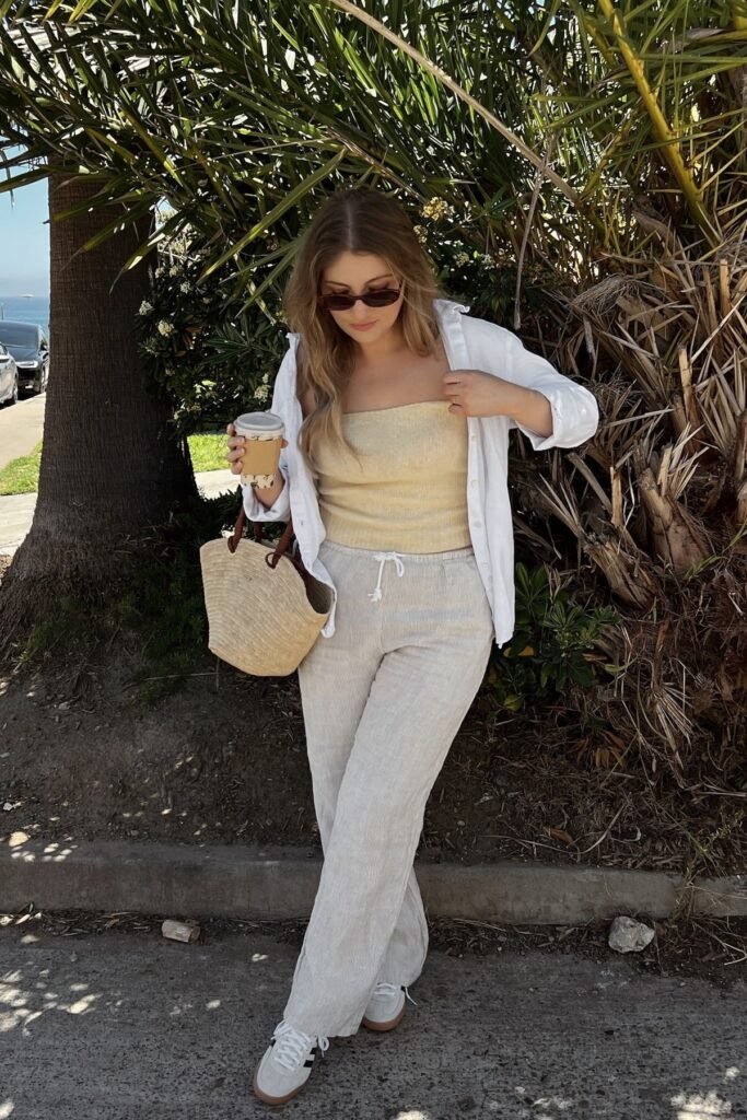 Open White Linen Shirt + Pale Yellow Tube Top + Beige Striped Drawstring Pants + White and Black Sneakers