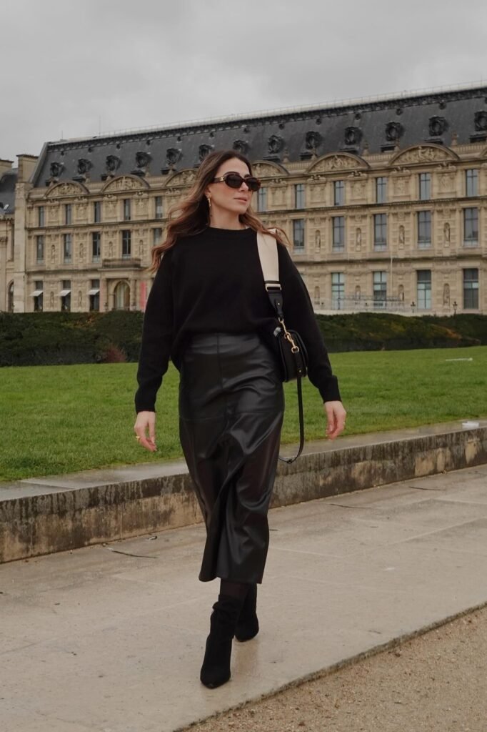 Oversized Black Crewneck Sweater + Black Leather Midi Skirt + Black Pointed-Toe Suede Boots